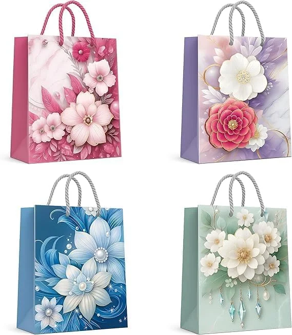 Assorted sizes and colours of matte finish kraft paper gift bags with reinforced handles, arranged in a group