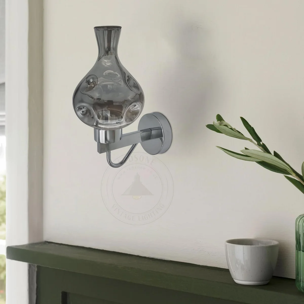 Antique brass mid century wall sconce with amber glass shade, wall‑mounted.