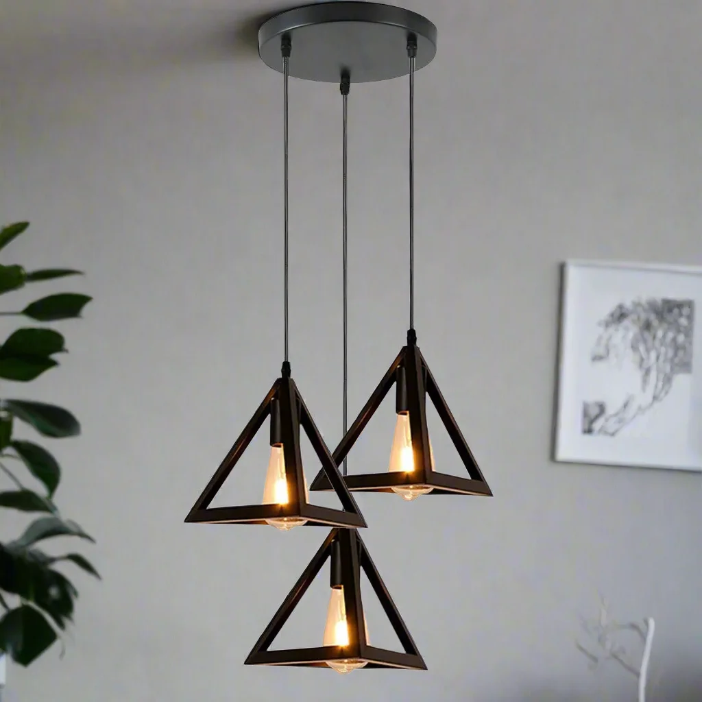 Black 3 head modern pendant light with metal barrel cages and adjustable cables hanging from ceiling rose