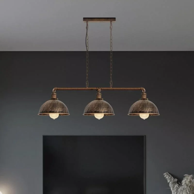 Industrial steampunk 3 way pipe pendant light with three E27 lamp holders hanging over kitchen island