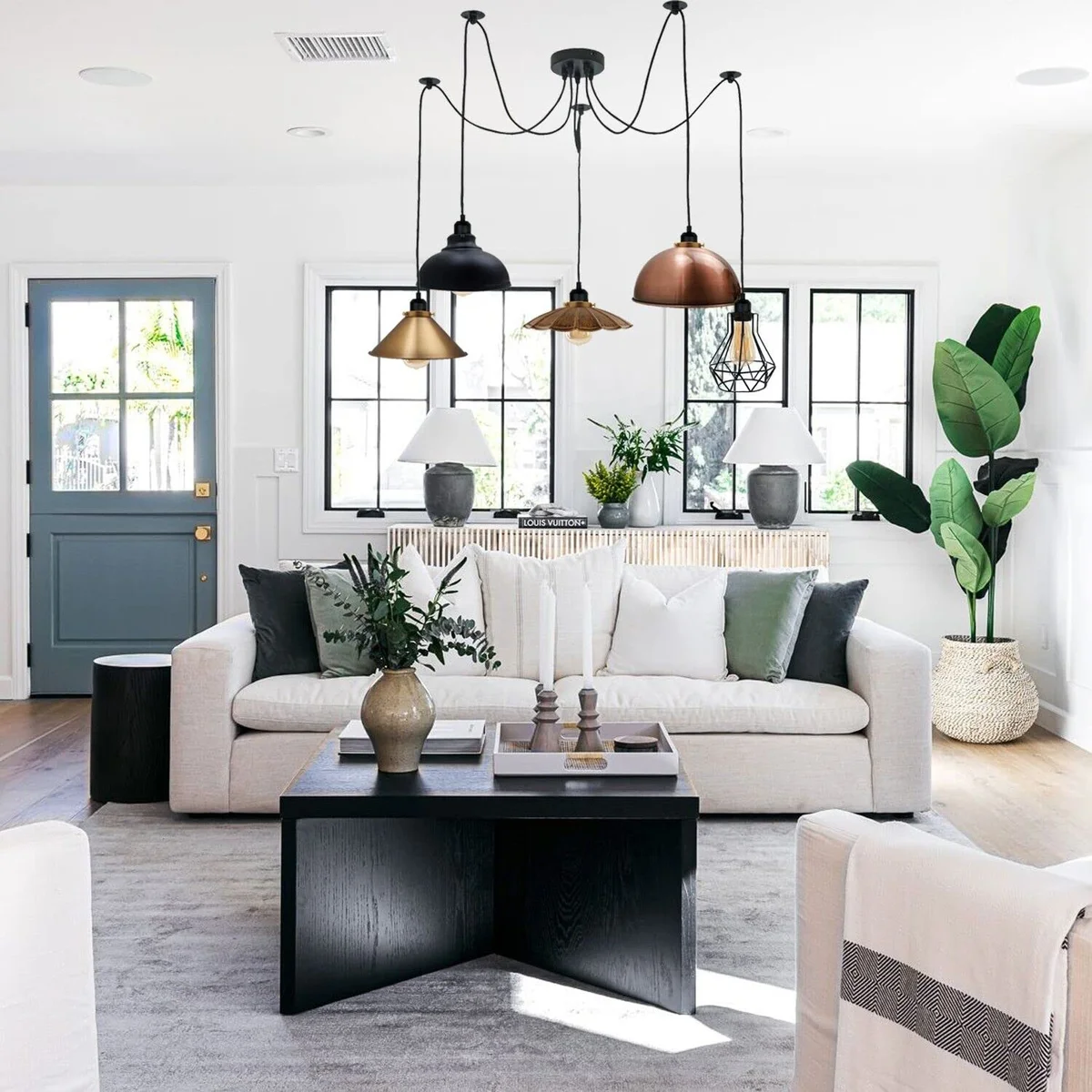 Five-way industrial E27 spider light fitting with mixed copper, brass, bronze, black dome, and wire cage shades hanging from adjustable cables