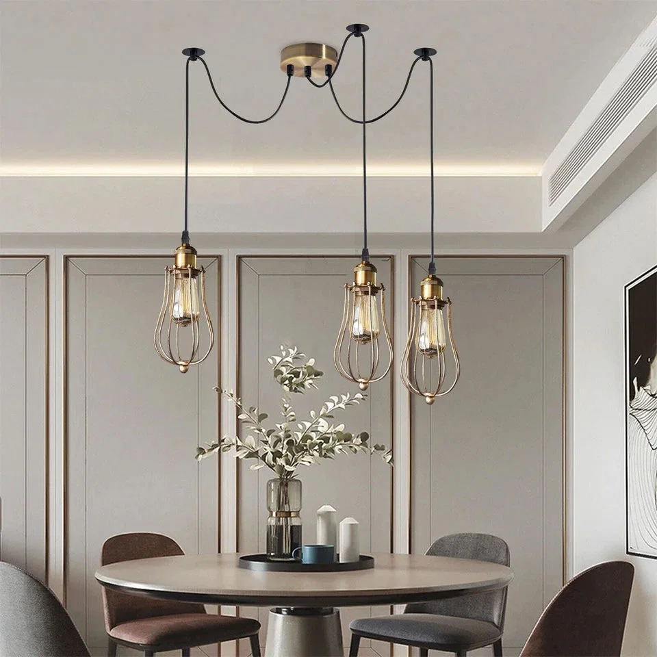 Antique brass industrial spider pendant with tiered teardrop wire cages and adjustable cables hanging from ceiling rose