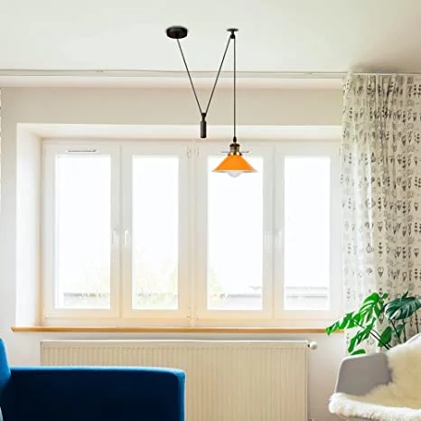 Black industrial pulley ceiling light fixture with metal pulley wheels and long adjustable cable, no bulb included.