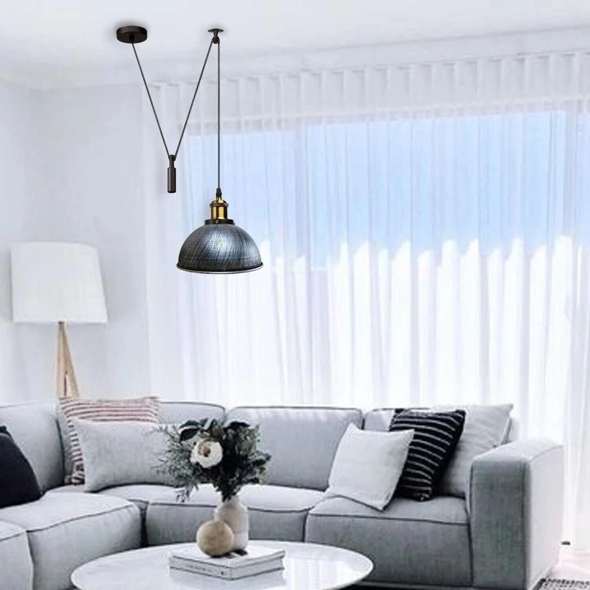 Black metal pulley pendant light with E27 holder, 200cm cable, and round ceiling plate against white background