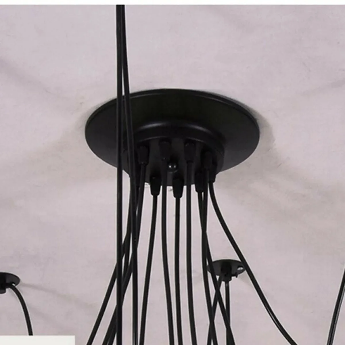 Black industrial spider chandelier with 8 adjustable arms and E27 bulb holders hanging from ceiling