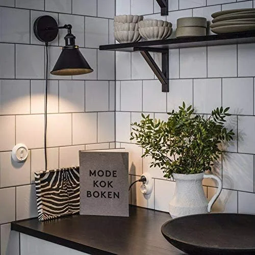 Adjustable black metal wall lamp with cone shade, swivel arm, and dimmer switch, shown mounted on a white wall