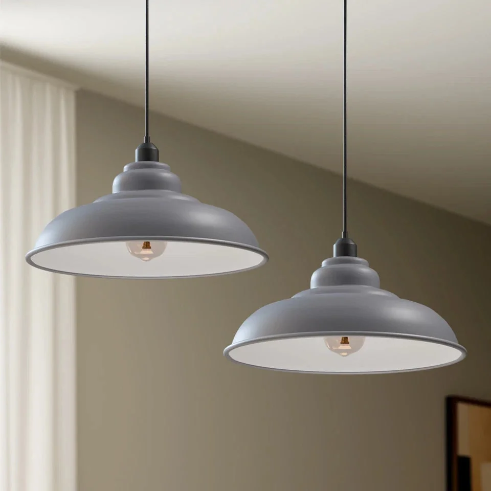 Modern grey metal industrial-style pendant light with black cable, suitable for kitchen or dining room lighting.
