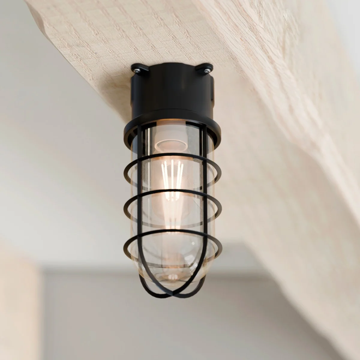 Retro style bulkhead cage ceiling light with metal frame and frosted tempered glass cover mounted on white wall