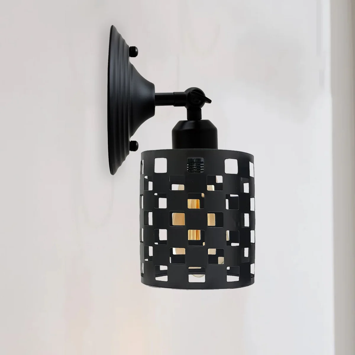 Black industrial adjustable wall light with metal cylinder shade and 240° rotating arm mounted on wall