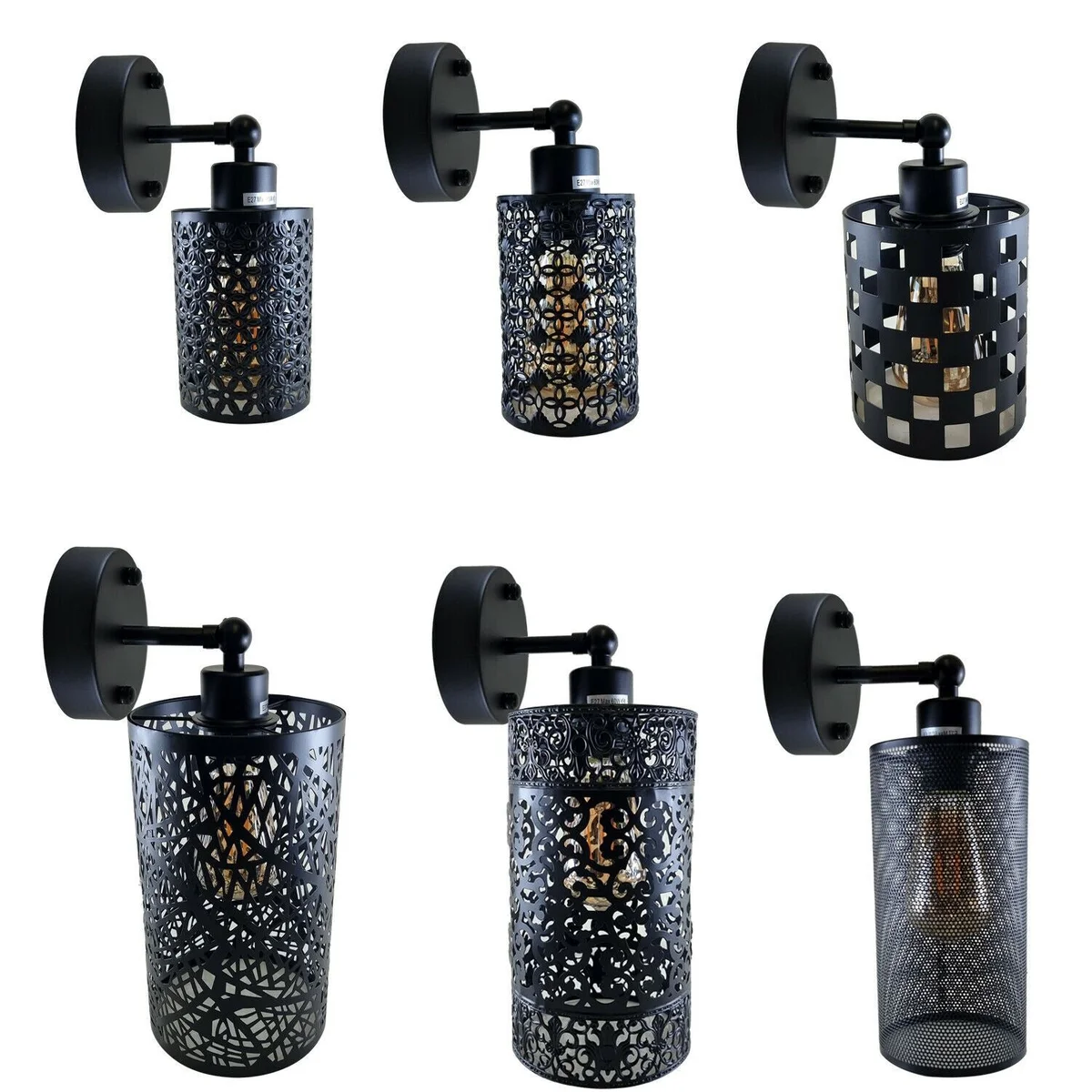 Black metal wall light with adjustable arm and cylindrical shade in industrial vintage style mounted on white wall