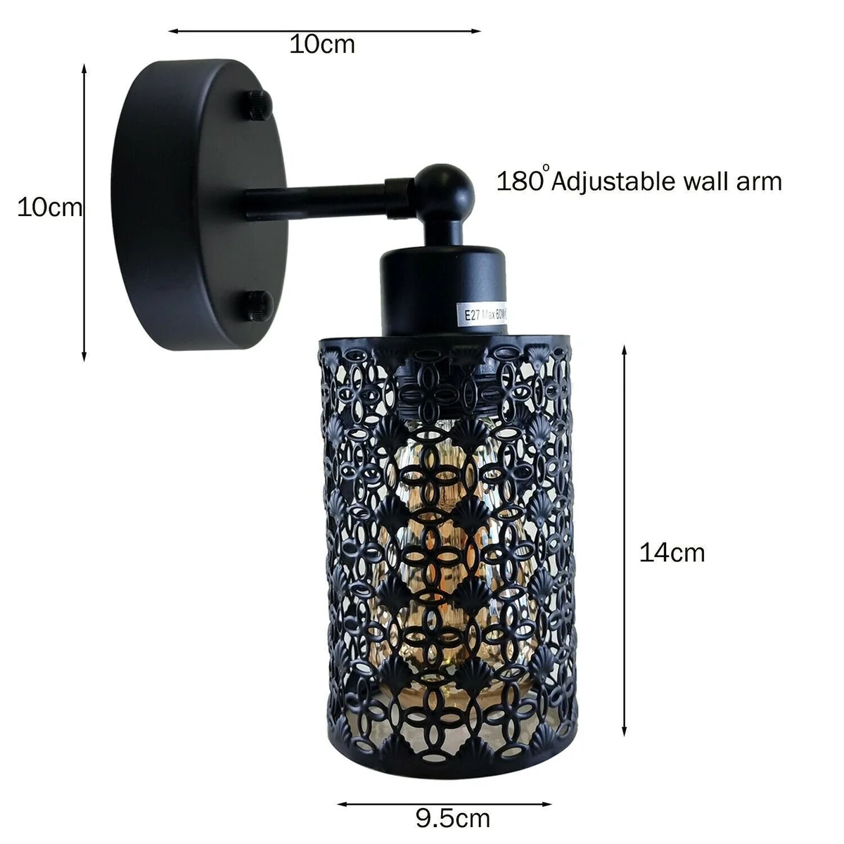 Black industrial adjustable arm wall lamp with cylindrical shade mounted on a white wall, showing arm extended and angled down