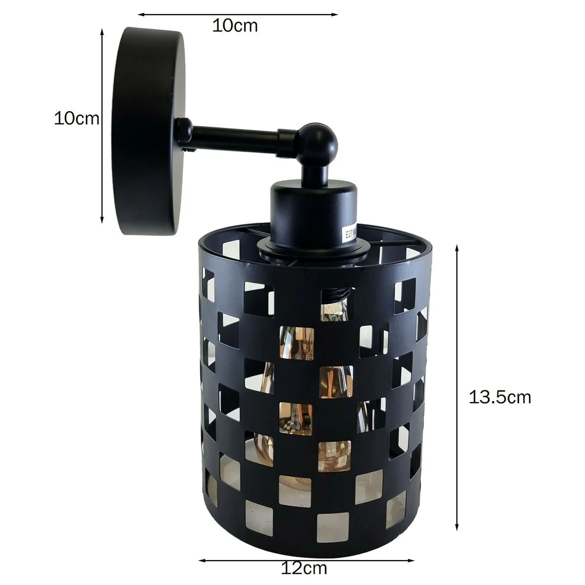 Black industrial adjustable wall light with cylindrical shade and metal arm mounted on a white wall