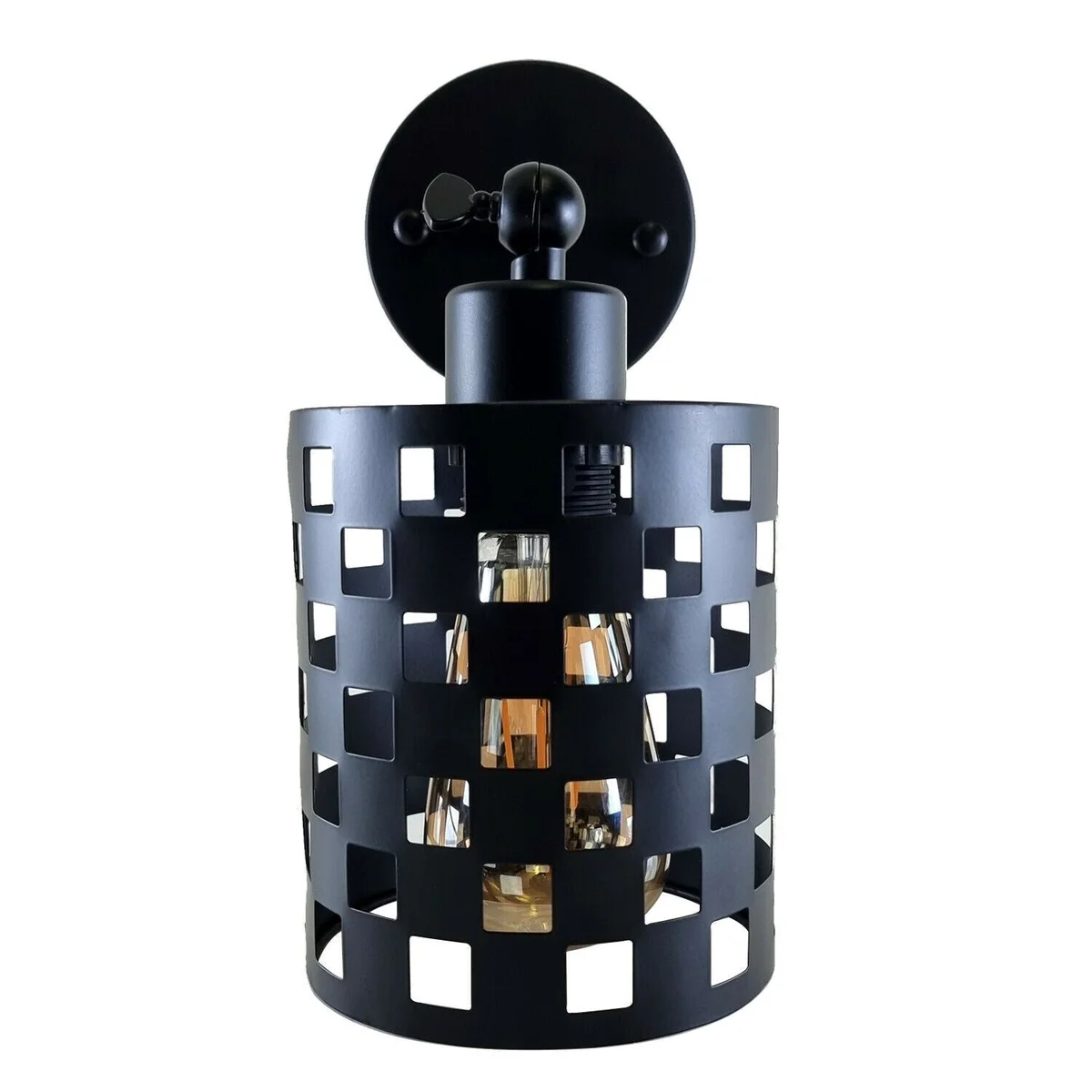 Black industrial adjustable wall light with metal cylindrical shade and rotating arm mounted on a white wall