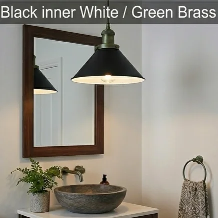 Two vintage pendant ceiling lights with metal cone shades in yellow brass and green finishes mounted flush to ceiling