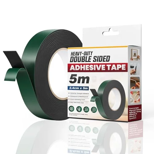 Roll of black foam double sided tape 2.4cm wide with green release liner, suitable for indoor and outdoor use.