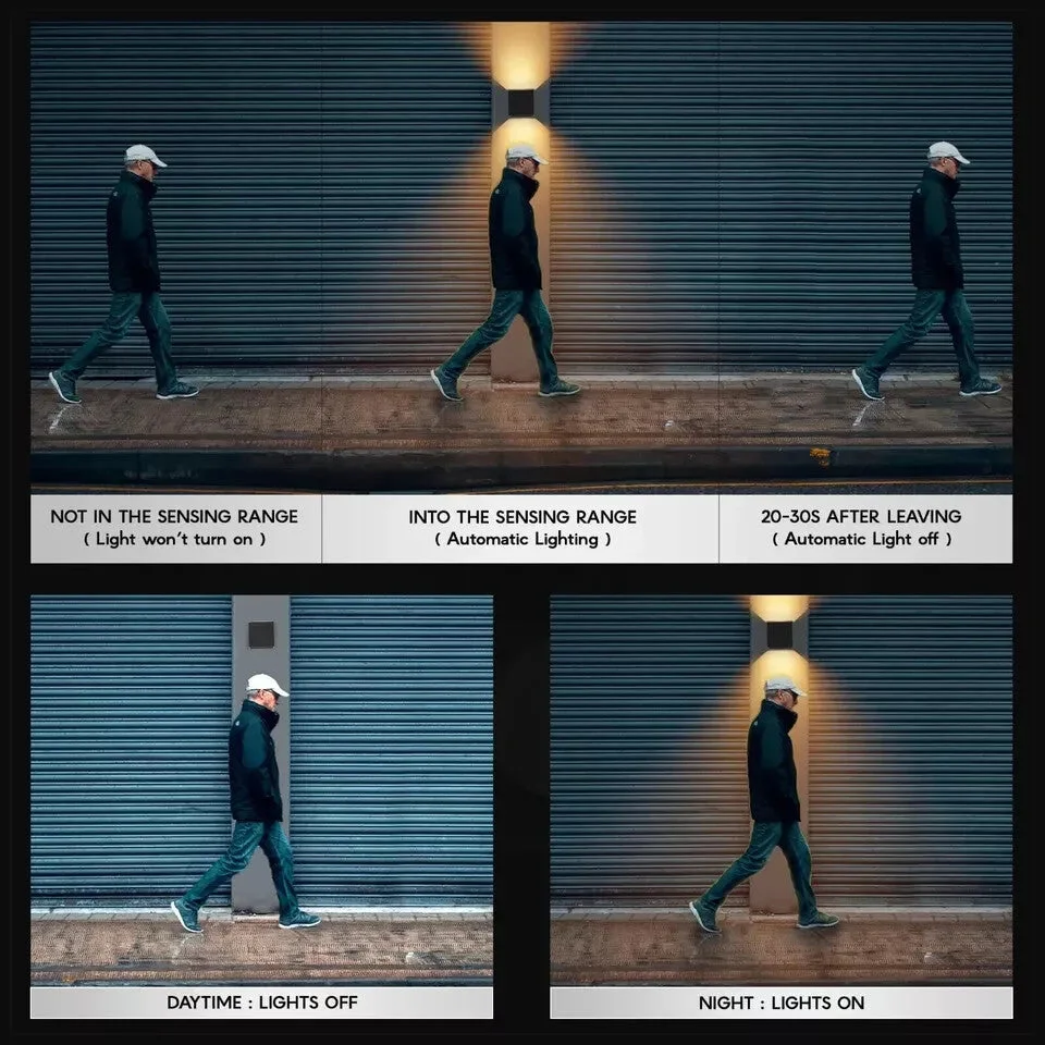 Two black square outdoor wall lamps with up and down warm white LED light and motion sensors mounted on a grey wall
