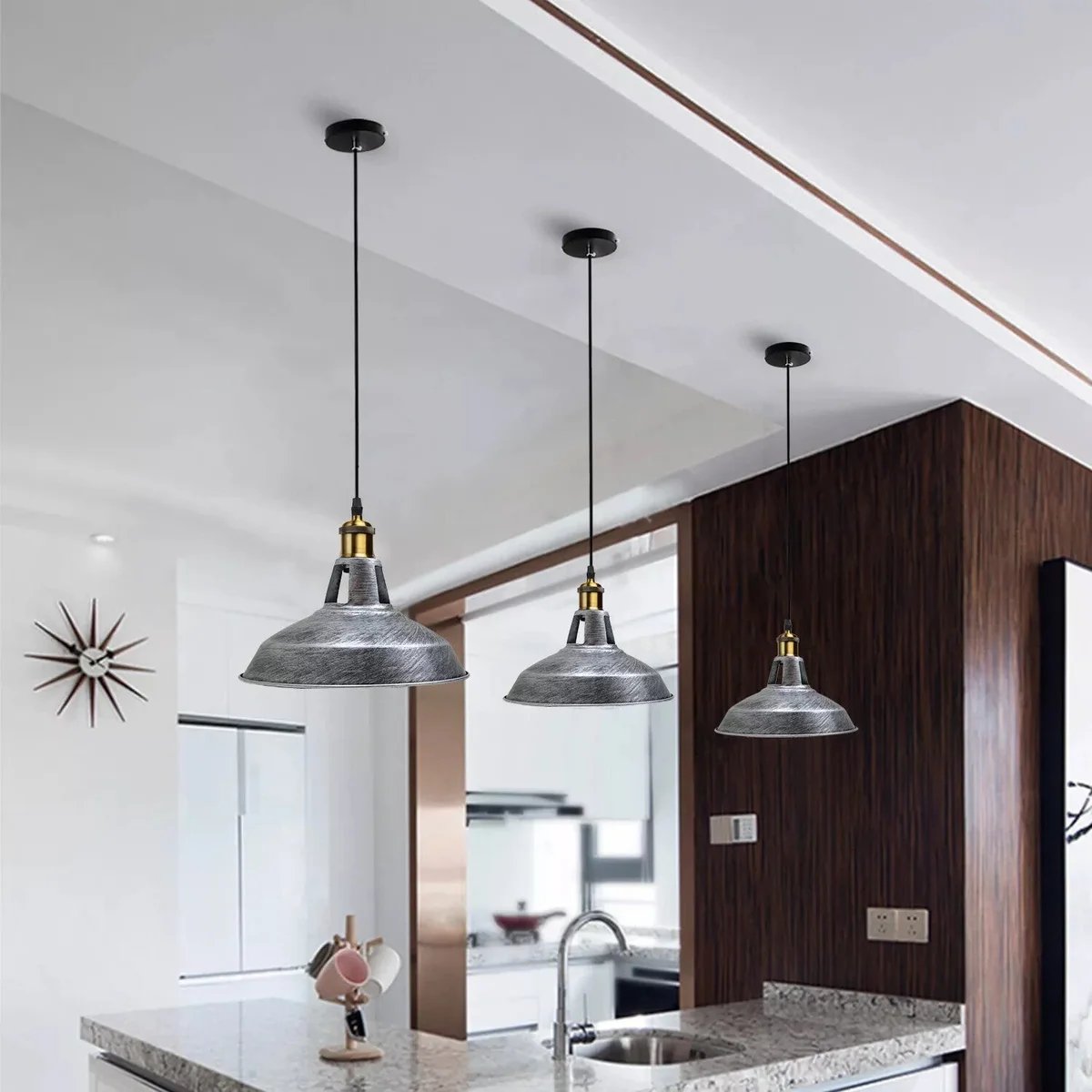 Black metal pendant light with brushed silver shade and adjustable cable light hanging from ceiling mount