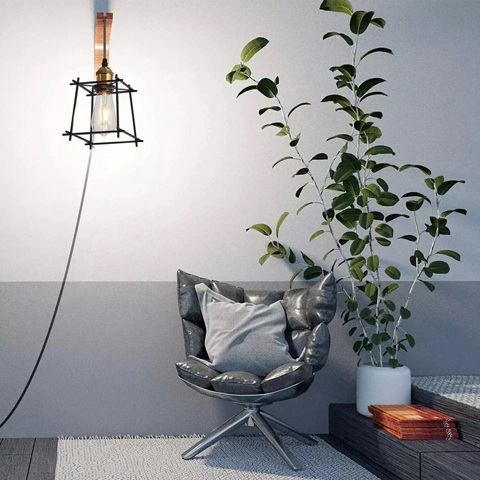 Matte black geometric cage plug in pendant light with antique brass socket and long 4m cord hanging from ceiling hook