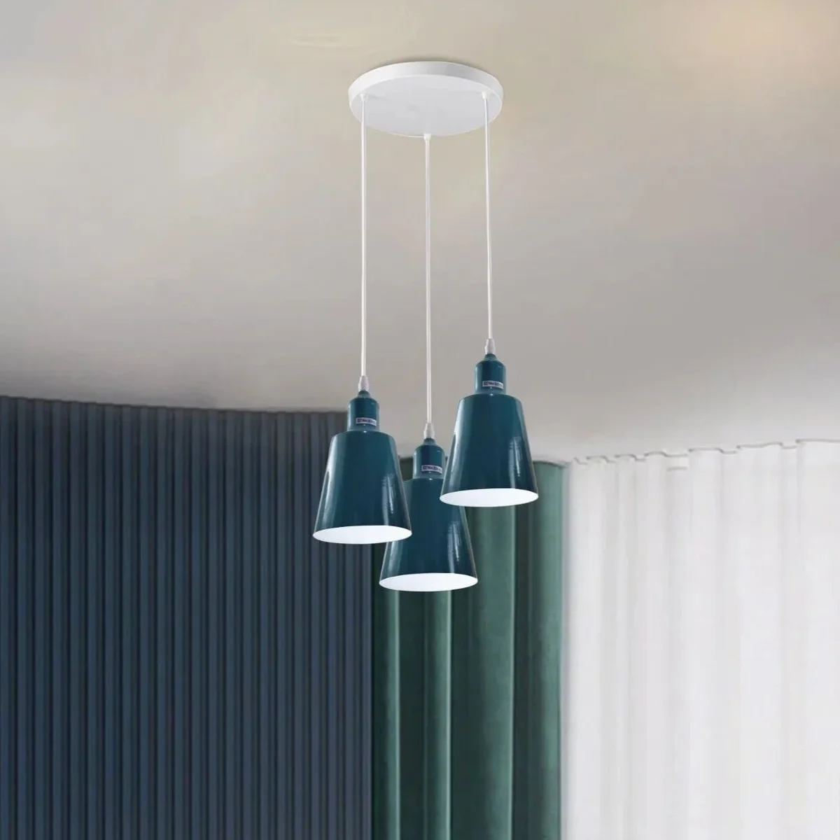 Industrial vintage ceiling pendant light with three adjustable metal lamp holders and black cords hanging from ceiling base