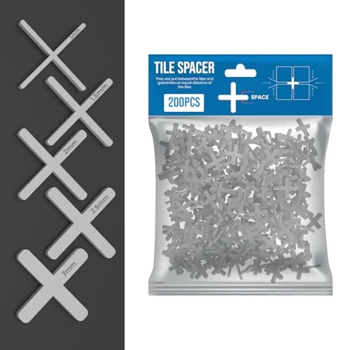 White plastic cross-shaped tile spacers plastic arranged in a pile for tiling gaps, 200 pieces shown on a white background