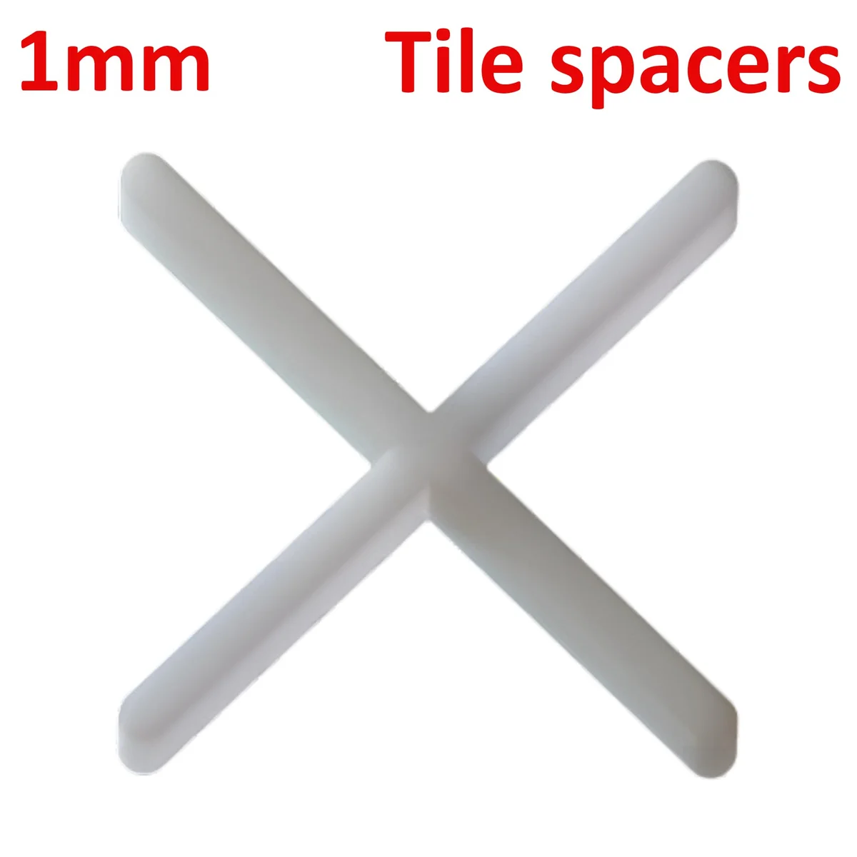 Close-up of white tile spacers in cross shape, made from durable plastic, arranged neatly on a surface