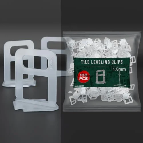 White X-shaped tile leveling system spacers clips made from durable plastic, shown in a pile on a white background