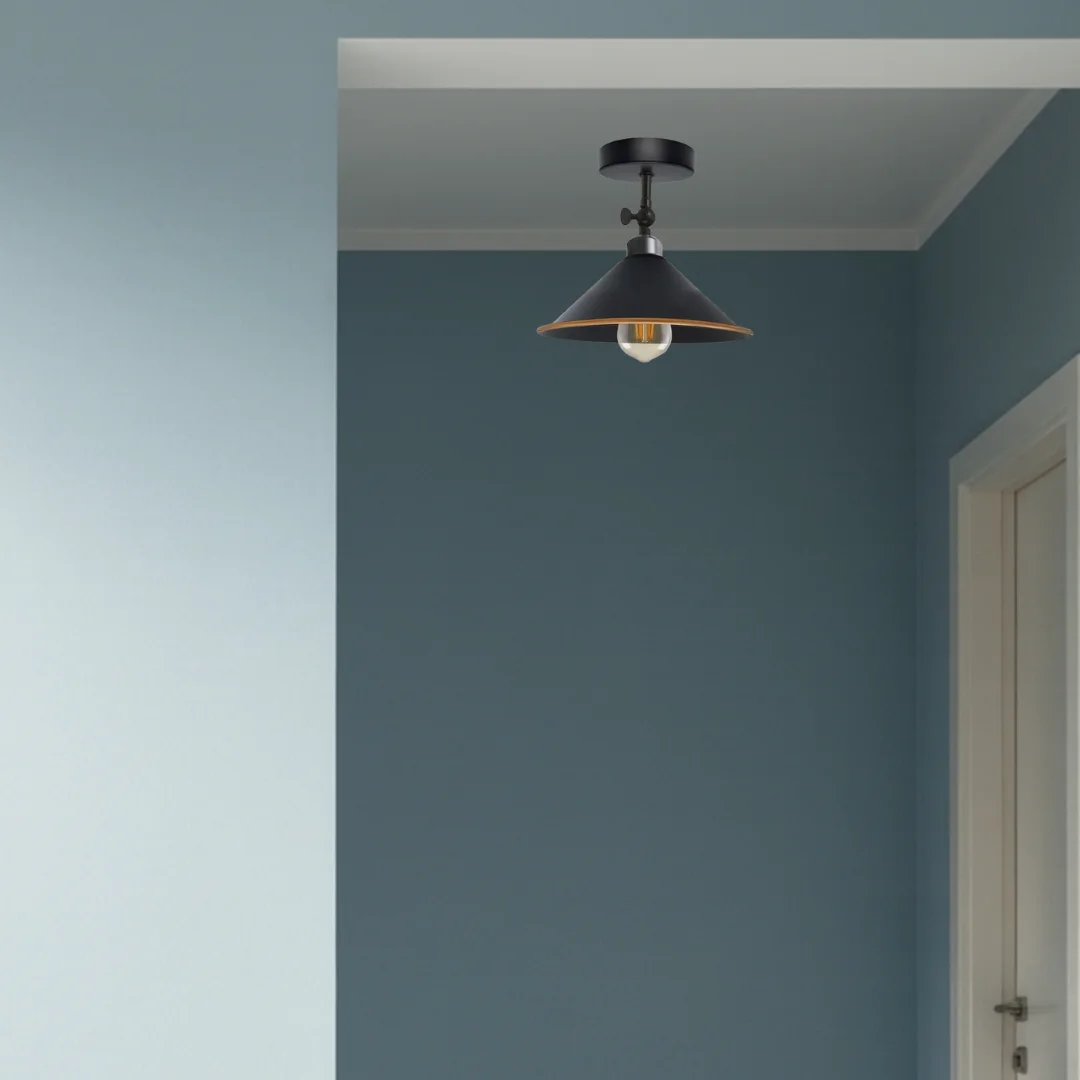 Vintage industrial flush mount ceiling light with metal finish and adjustable angle, suitable for indoor use.