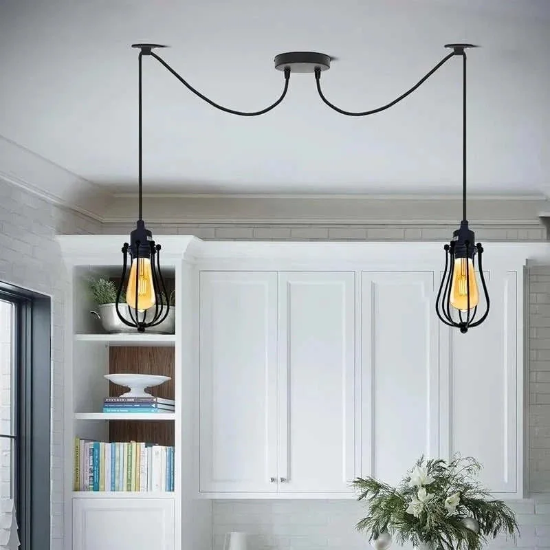 Black industrial lamp with 2 adjustable arms, metal shades, and fabric-covered cables hanging from ceiling mount