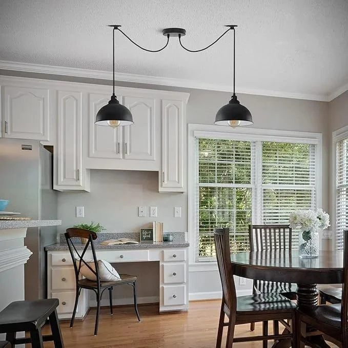 Black industrial ceiling light with 2 adjustable arms and round metal shades hanging from fabric cables