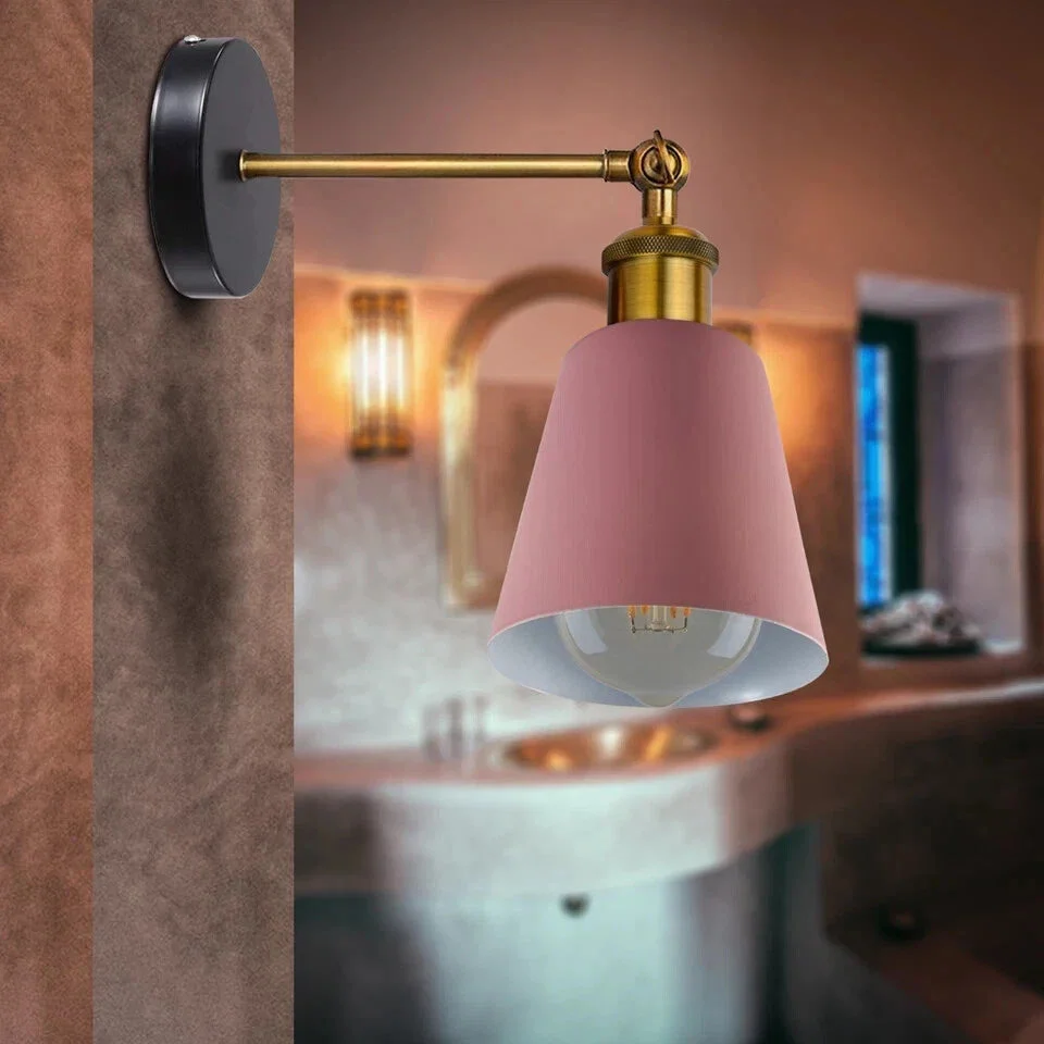 Industrial style black metal wall light with E27 bulb holder, mounted on a wall, showing rustic vintage design details