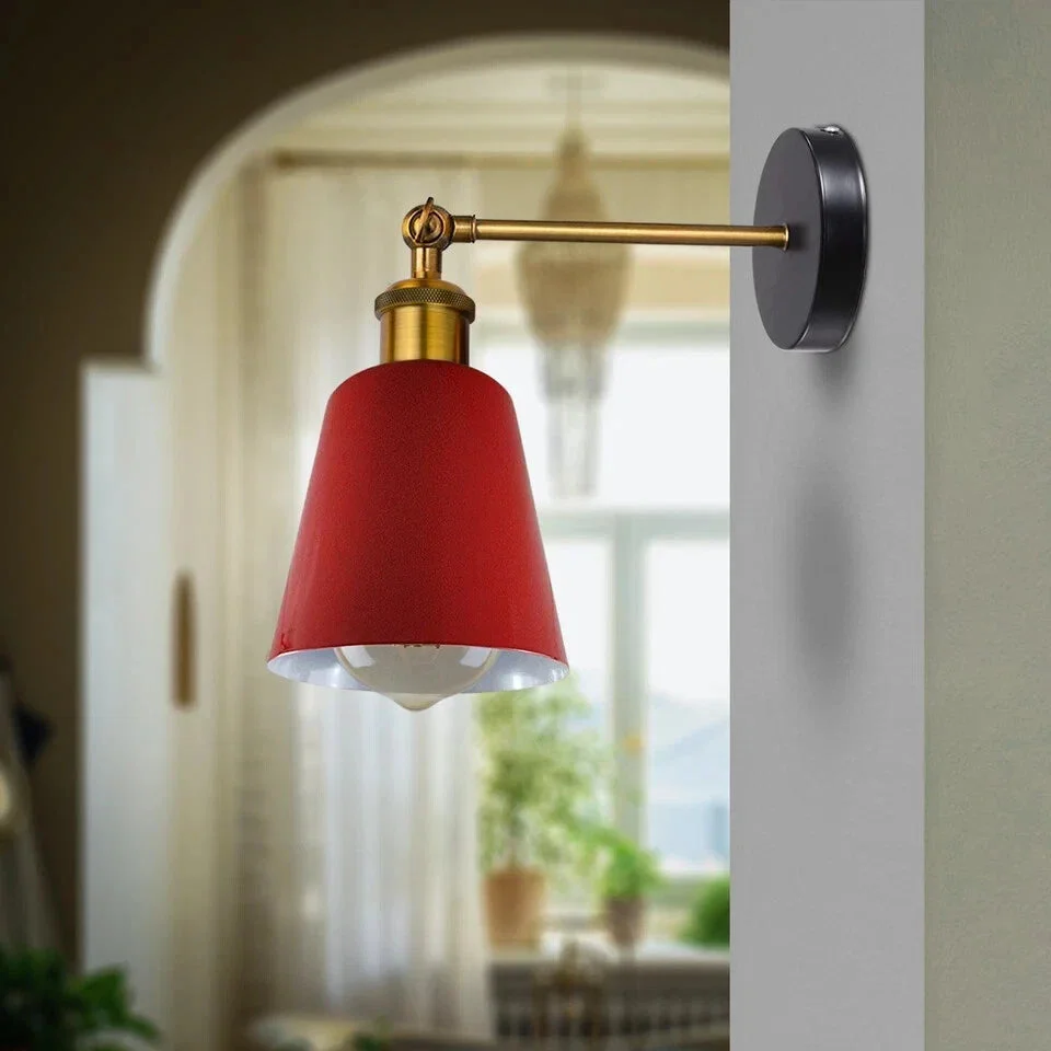 Industrial metal E27 wall light fitting in black with vintage lampshade, mounted on a white wall, showing rustic design details
