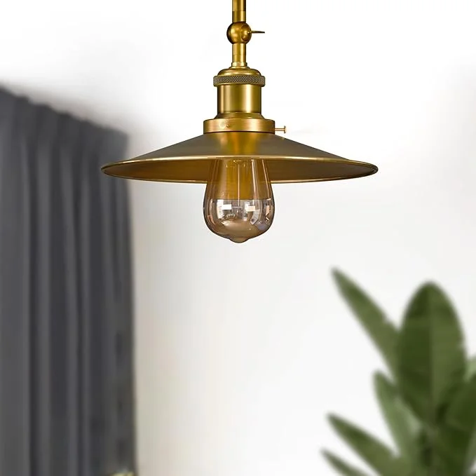 Yellow brass ceiling light with polished metal curvy shade and semi flush mount design, 22cm wide and 19cm high