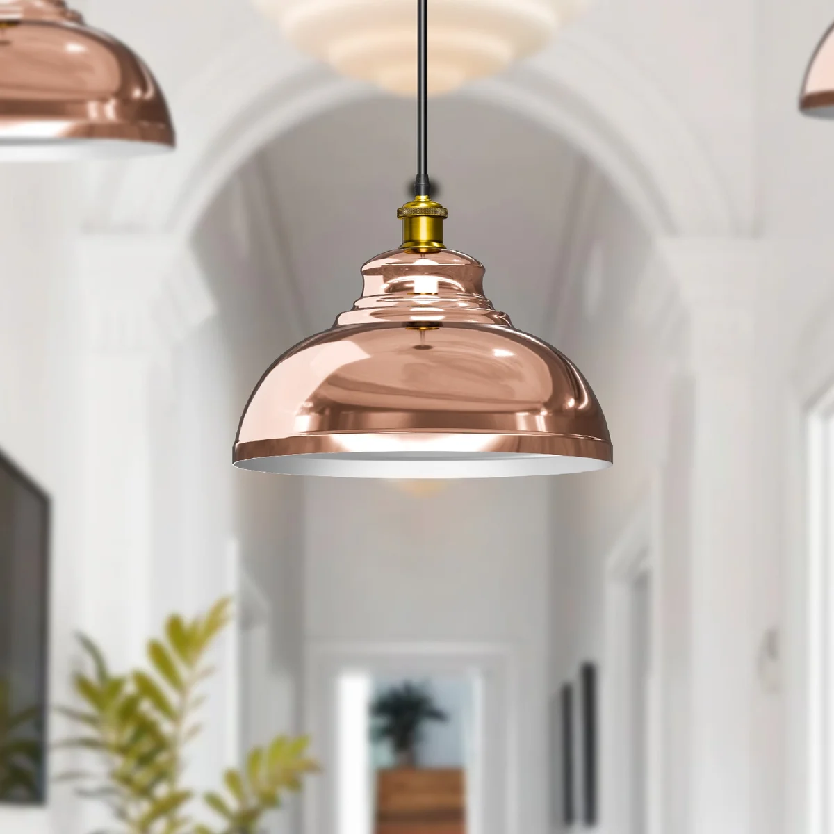 Metal dome-shaped E27 pendant light with adjustable 95cm cable hanging from ceiling in modern interior setting