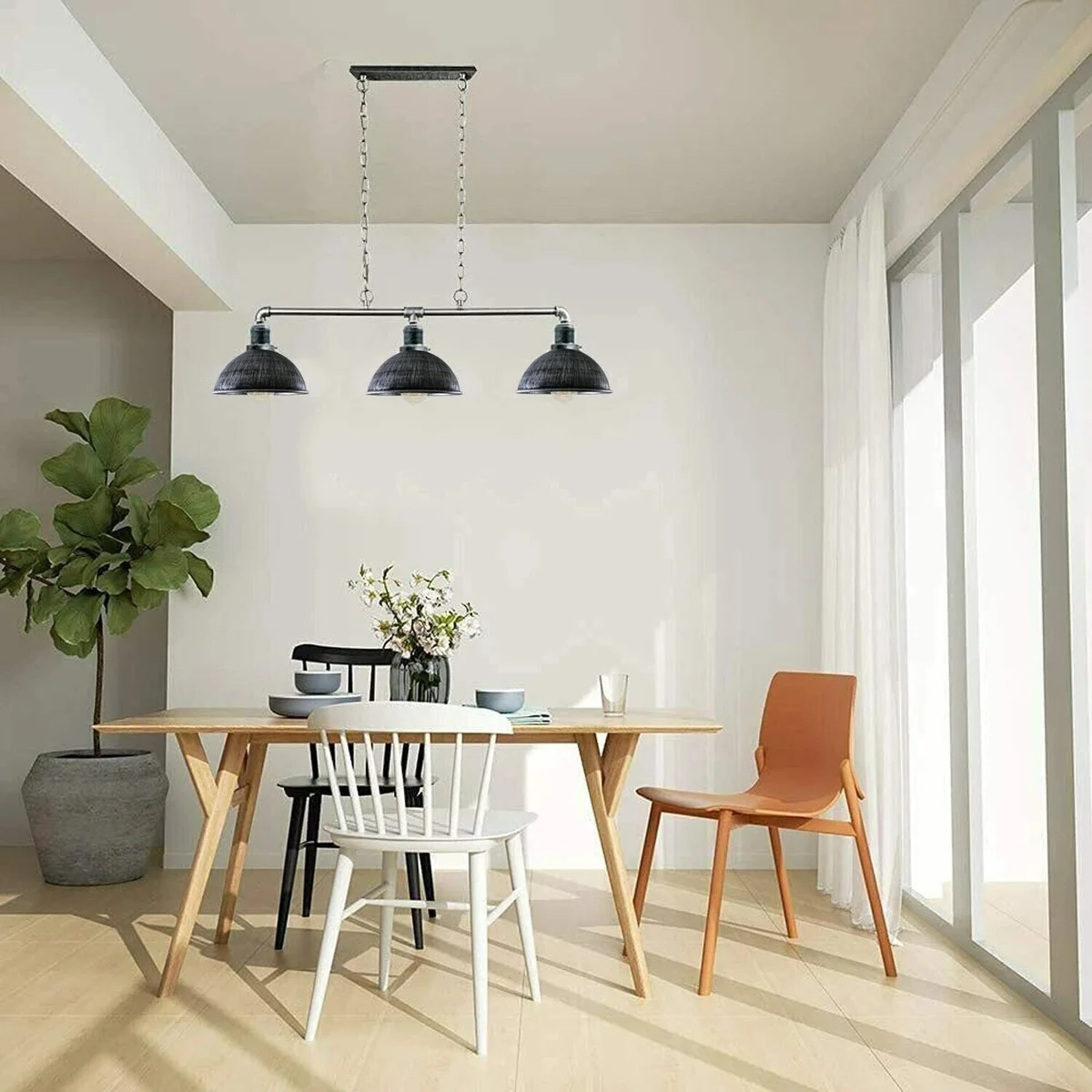 Industrial ceiling light with black metal pipe frame and three cup lamps, a steampunk‑inspired vintage design.