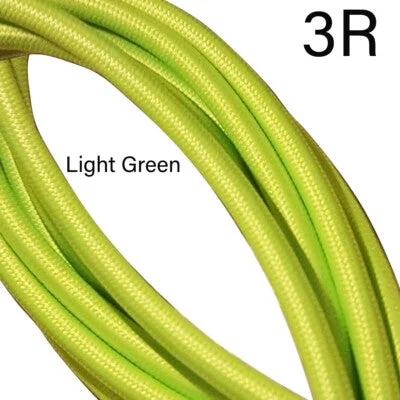 Coiled light green 3-core indoor fabric cable with braided fabric finish, suitable for vintage style lighting installations