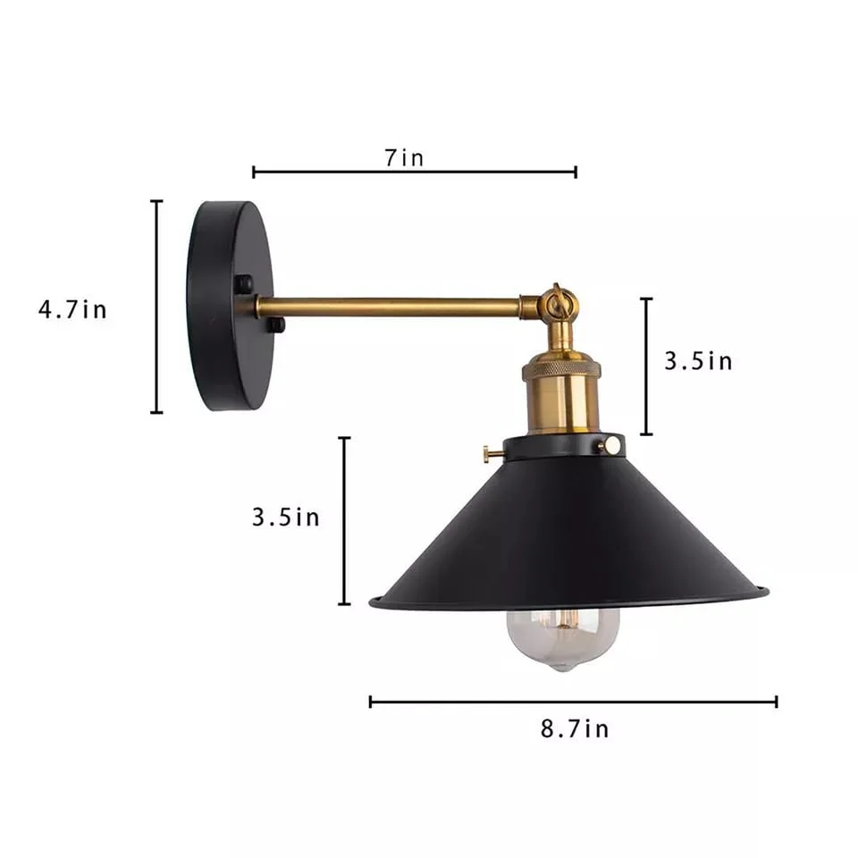Pair of vintage industrial adjustable wall lamps with cone-shaped metal shades mounted side by side on a wall