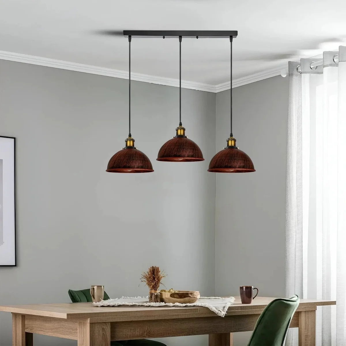 Adjustable pendant light with three vintage metal shades in rustic red, brushed copper, and brass finishes hanging from cables