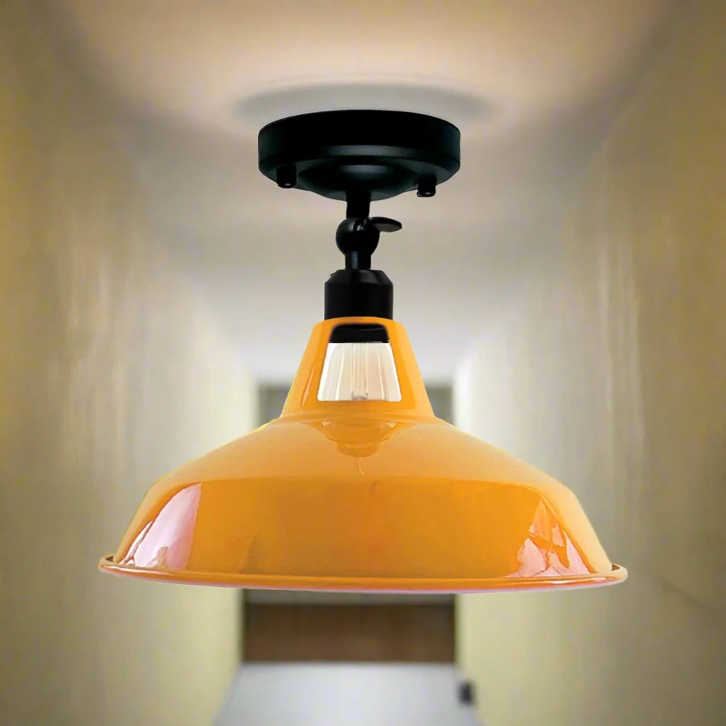 Vintage ceiling light with brushed metal dome shade and adjustable mount, designed for sloped ceilings, white interior finish