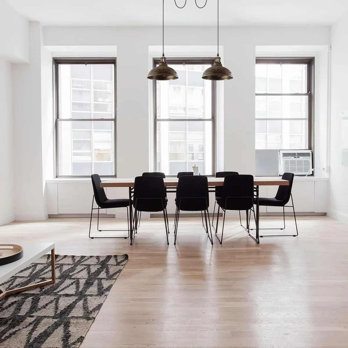 2 head ceiling pendant light with adjustable metal arms and black industrial finish hanging from ceiling