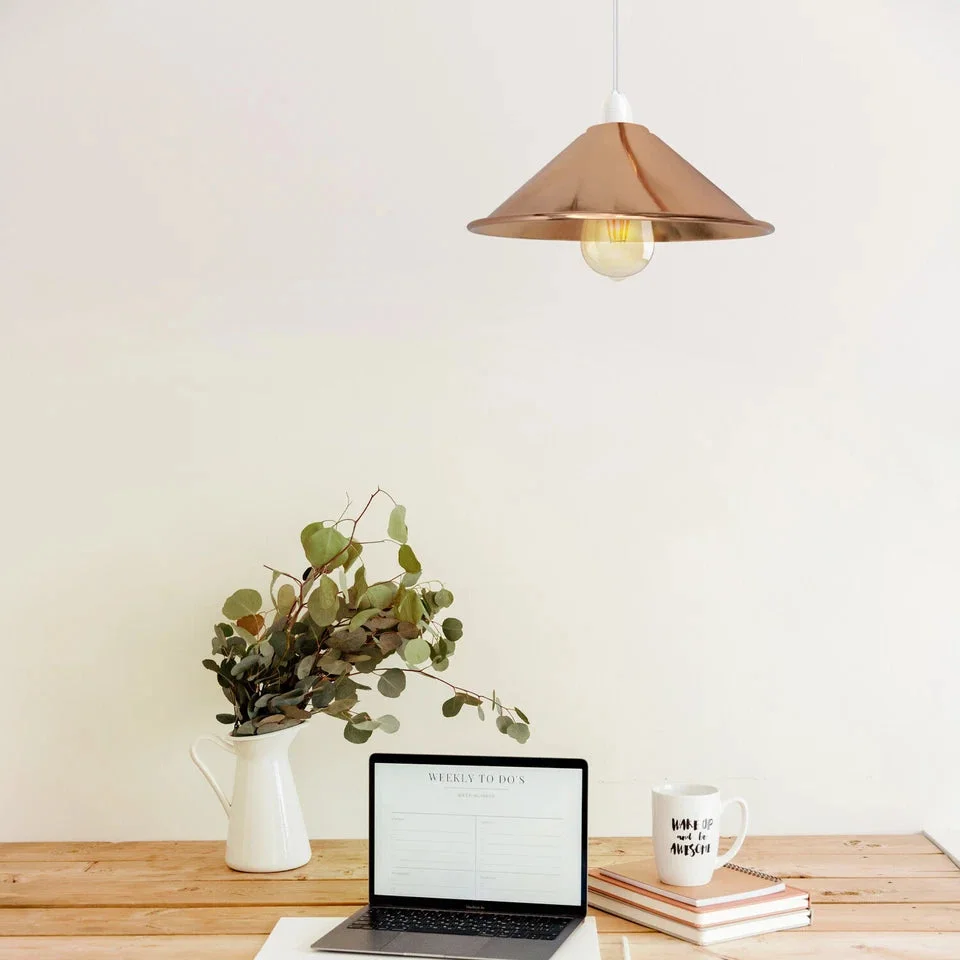 French gold industrial metal wall light shade with easy fit design shown mounted on a white wall indoors
