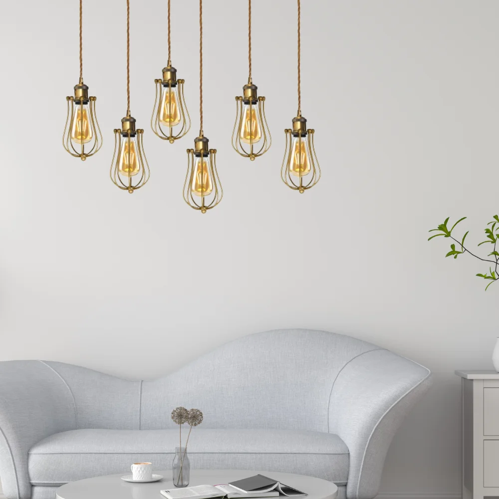 Industrial balloon wire cage E27 pendant light with antique yellow brass finish and adjustable gold cord hanging from ceiling