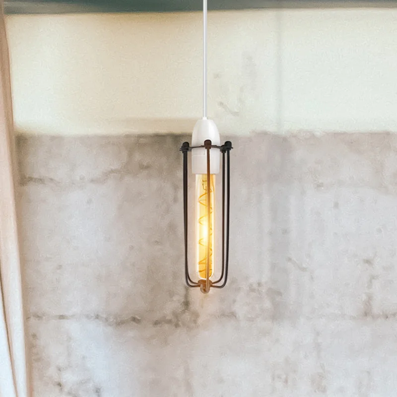 Black vintage industrial wire cage pendant lampshade shown installed, highlighting easy fit ceiling light design and slim profile