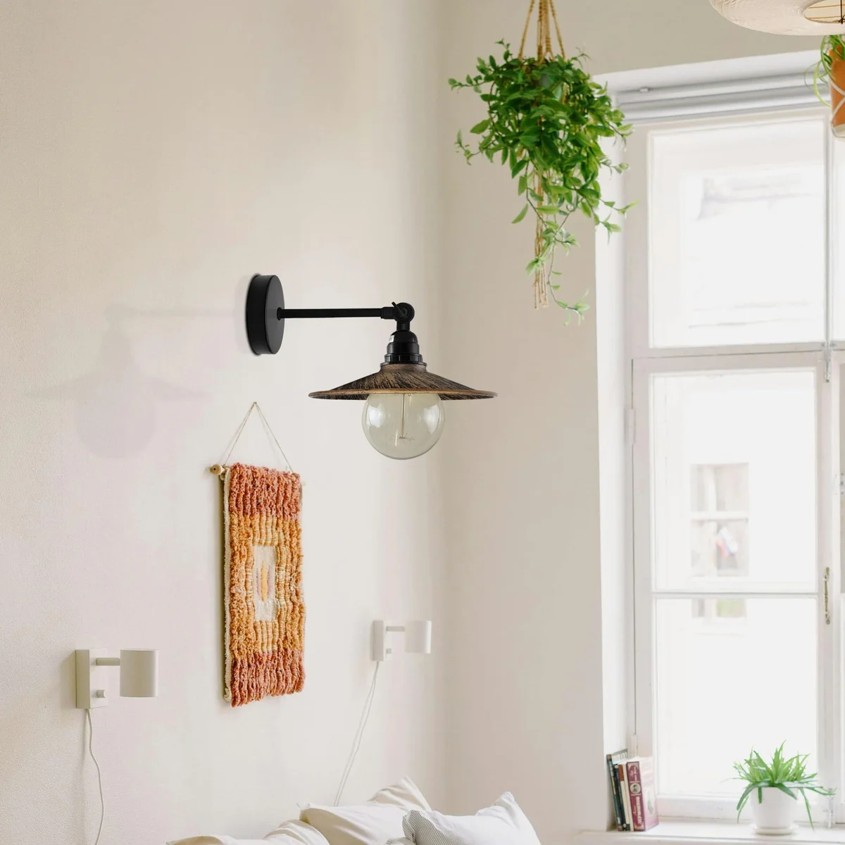 Metal flat shade wall sconce with adjustable arm, industrial style, black metal finish, suitable for indoor wall mounting