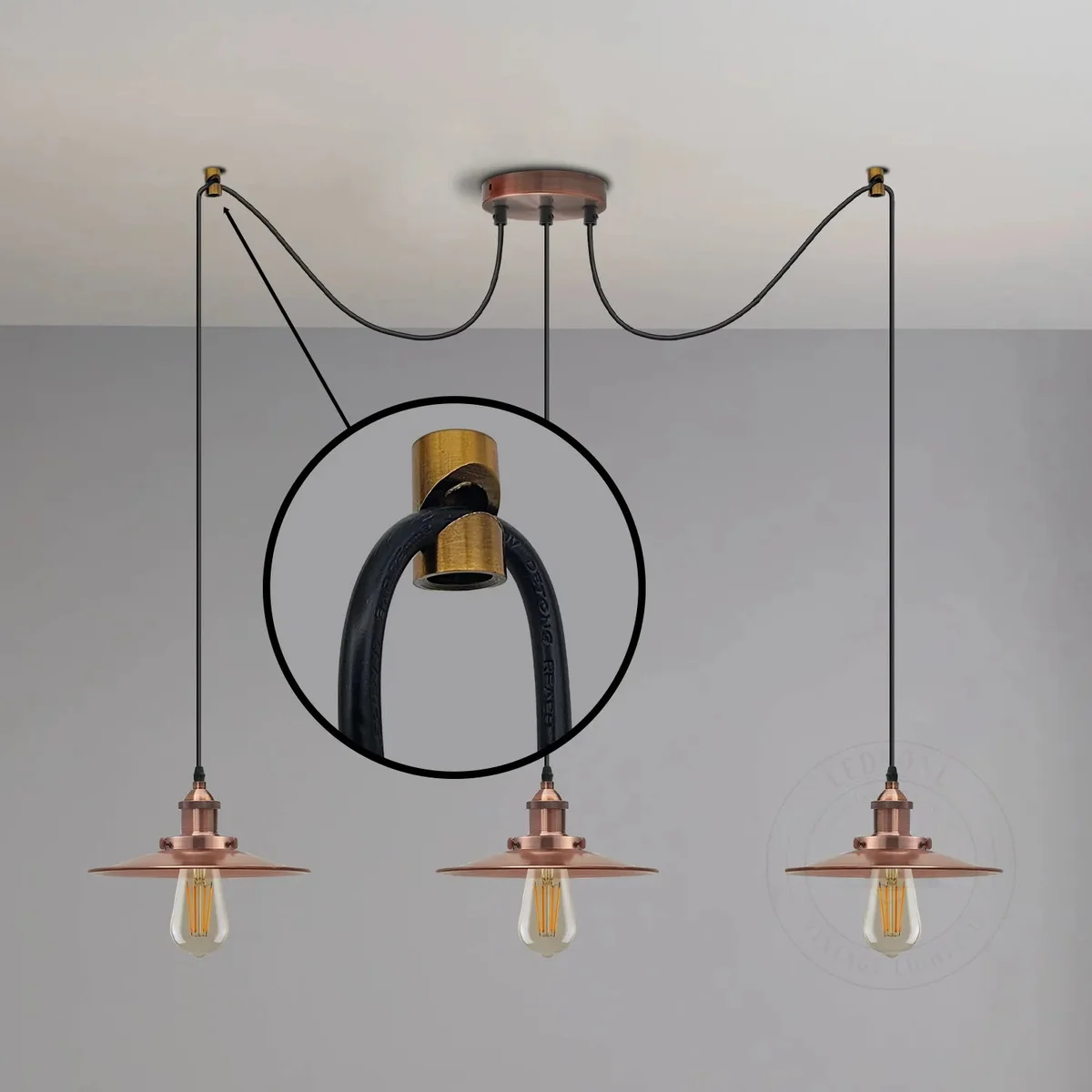 Round V hook metal cable holder for pendant lights mounted on white background with visible power button side detail