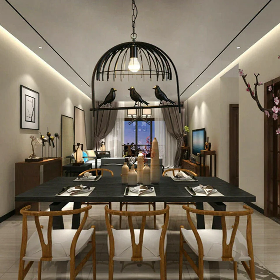 Vintage brass industrial ceiling chandelier with birdcage design and black fabric pendant cable hanging from ceiling