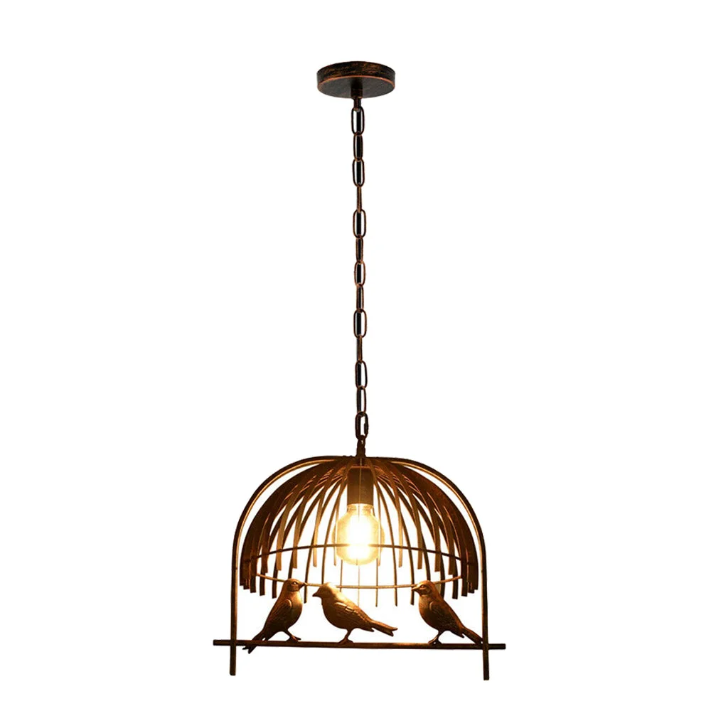 Vintage brass industrial birdcage pendant light with black fabric cable light hanging from ceiling canopy