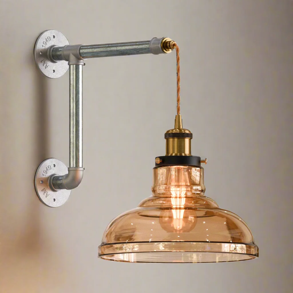 Industrial conduit wall light featuring amber glass shade on galvanized iron conduit pipe, adjustable fabric cord, rustic look