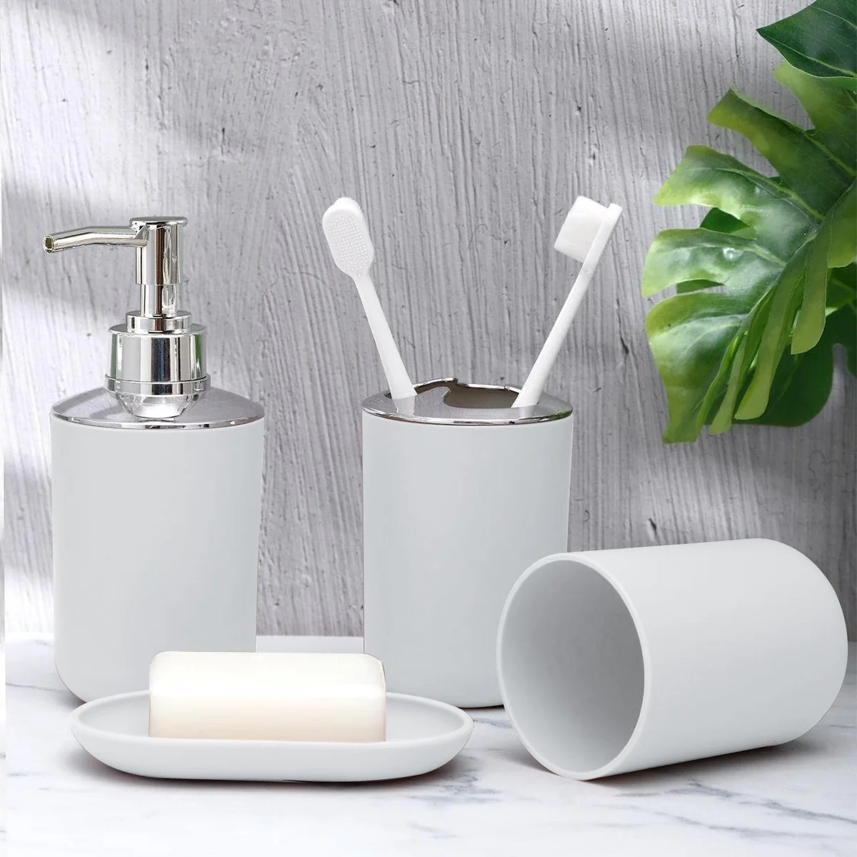 Plastic bathroom set showing a Morandi blue soap dispenser with pump, matching soap dish, and storage cup on white background