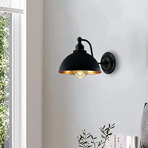 Vintage wall lamp, metal, black with cone-shaped cap, sleek industrial design.