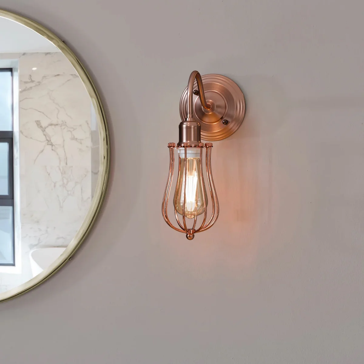 Industrial wall sconce with copper finish, dome-shaped metal shade, angled mount, and E27 bulb holder in vintage style